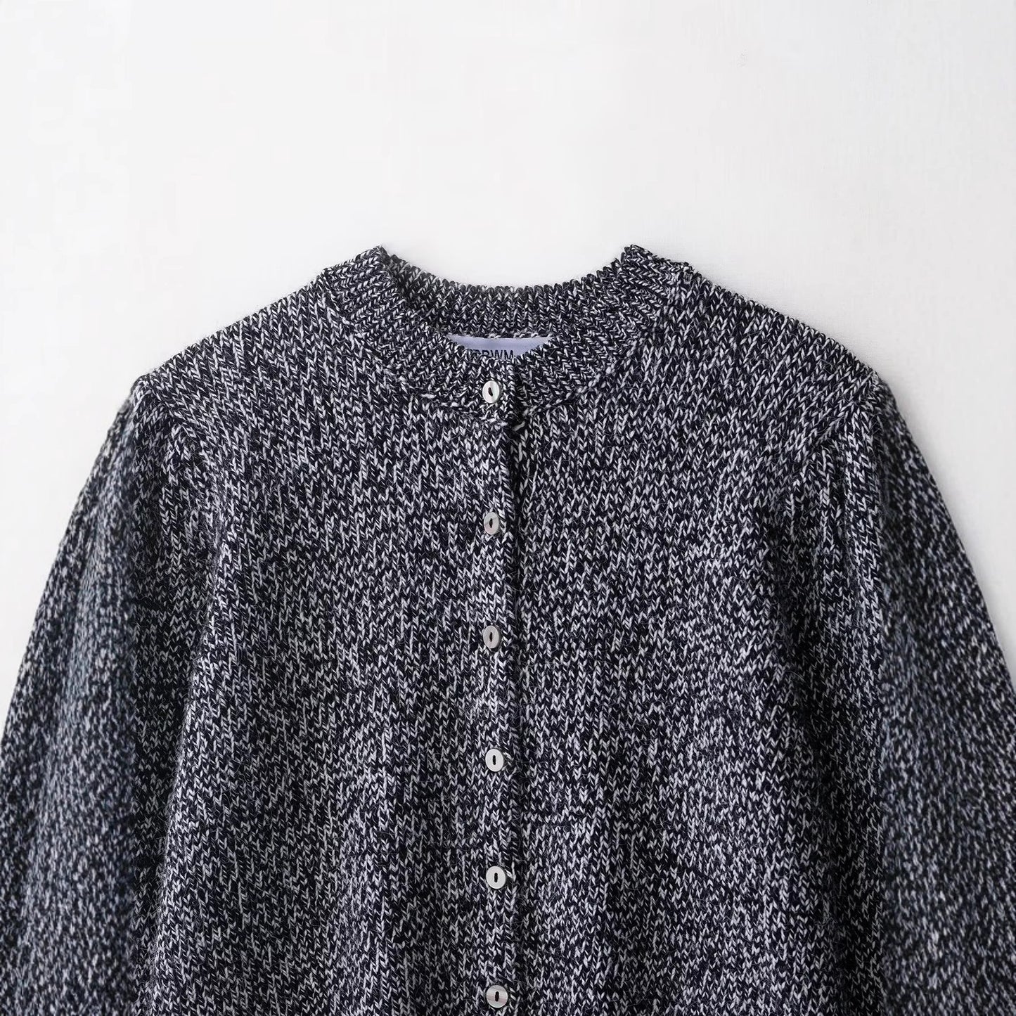 Round neck nine sleeves single breasted solid color knitted sweater for women